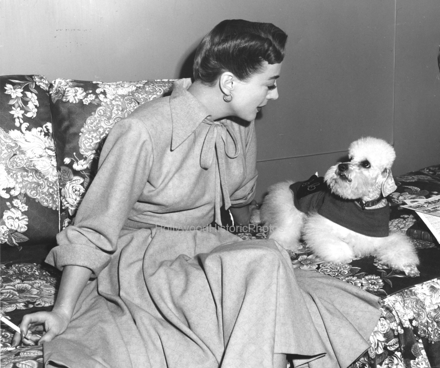 Joan Crawford 1947 2 With Cliquot her pet poodle wm.jpg